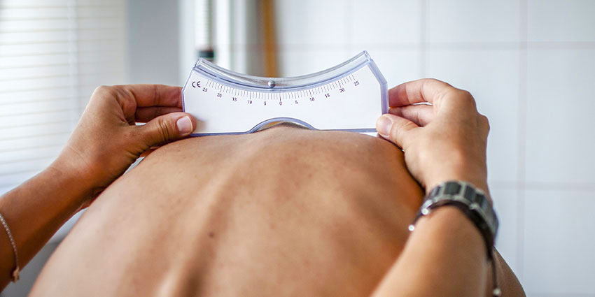 patient needing scoliosis chiropractor in Austin