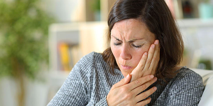 patient needing jaw pain chiropractor in Austin