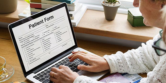 new patient of True Chiropractic filling out forms online before his appointment